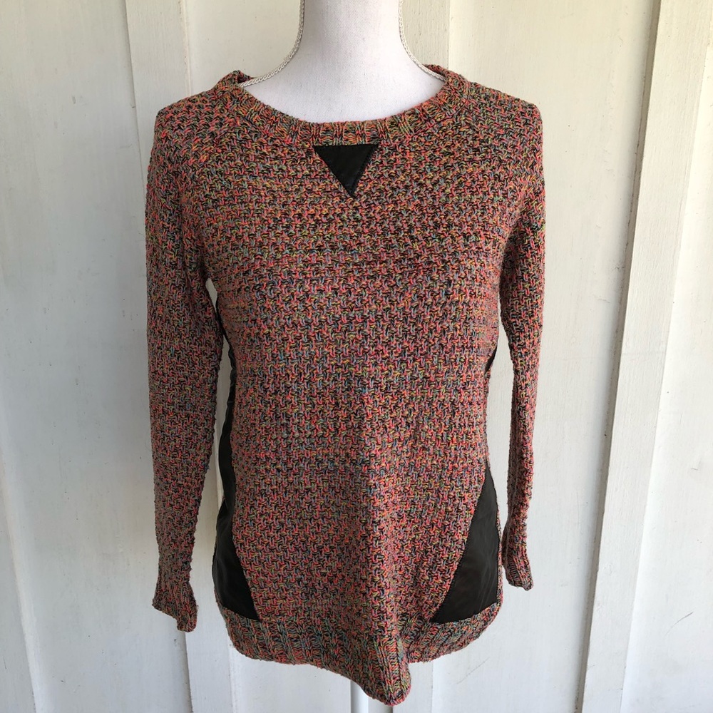 Bright and colorful knit sweater with faux leather